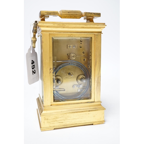 452 - ** ** A late 19th century French gilt brass cased eight day repeating carriage clock with key, 17cm ... 