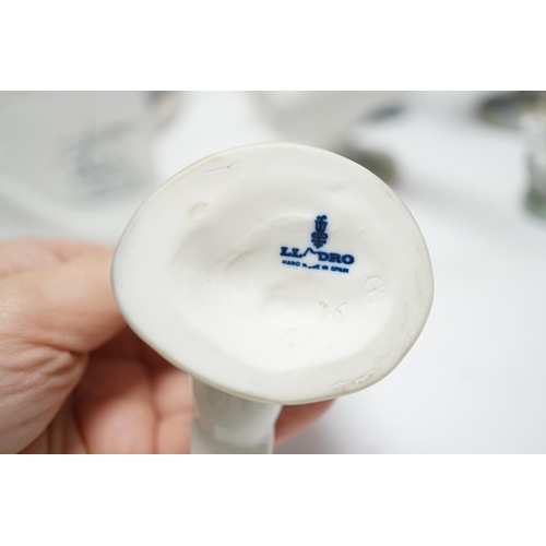 459 - Twelve Lladro figures including a dog and three ducks, a plaque and two cups together ith three Nao ... 