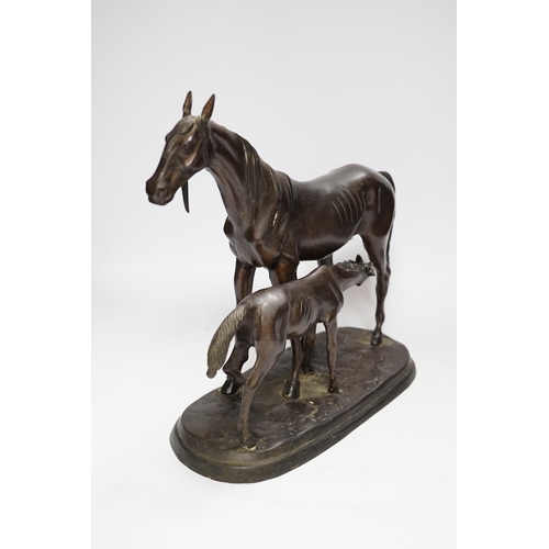 468 - A modern bronze mare and foal, 32cm long