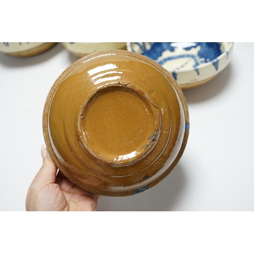 473 - A group of six slipware pottery bowls, 16cm