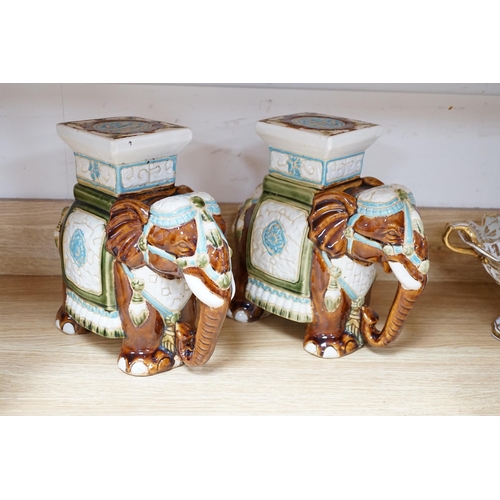 476 - A pair and another elephant and howdah garden seats, largest 43cm