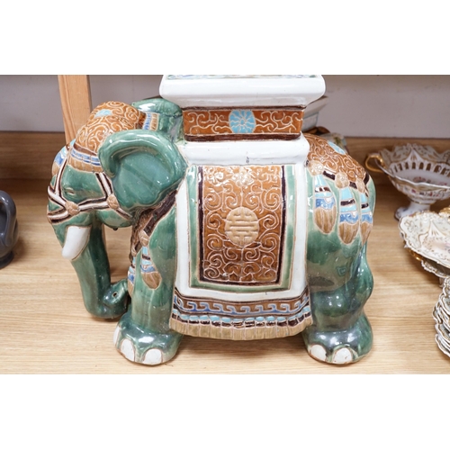 476 - A pair and another elephant and howdah garden seats, largest 43cm