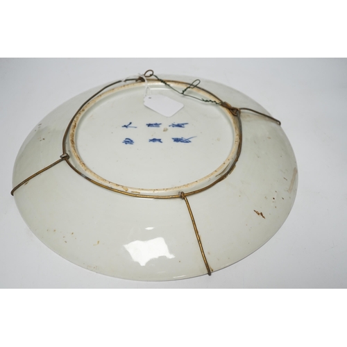 478 - A 19th century Japanese dish, painted with peonies, within a square, 40cms. dia.