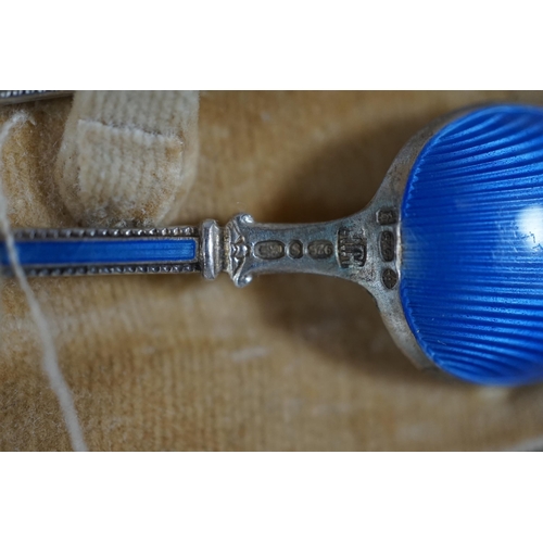 484 - A cased Worcester powder blue and silvered coffee set with enamelled silver spoons together with a c... 