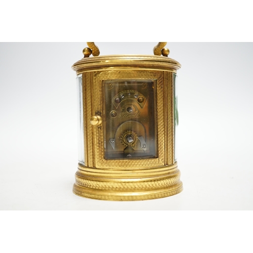 502 - * * A late 19th French miniature engraved oval cased carriage timepiece, height 7cm Please note this... 