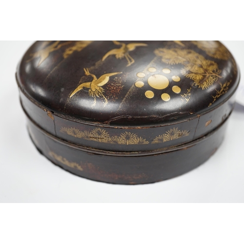 544 - A Japanese cast mirror, housed in a lacquered case, 12cm in diameter