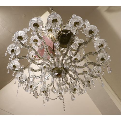 561 - A Swarovski twenty four branch chandelier