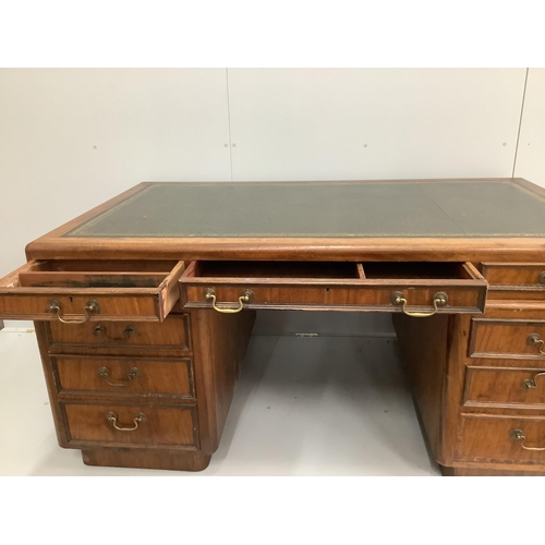 64 - A mid century mahogany pedestal desk, width 162cm, depth 93cm, height 76cm