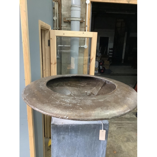 7 - A circular bronze dish on square galvanised stand, height 160cm