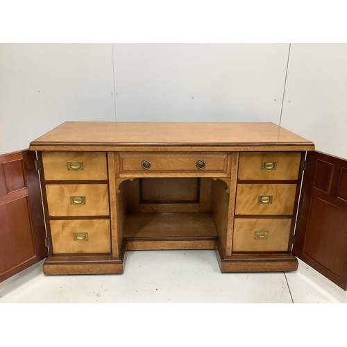 72 - A late Victorian bird's eye maple kneehole desk by Moore and Hunton, London, width 140cm, depth 60cm... 