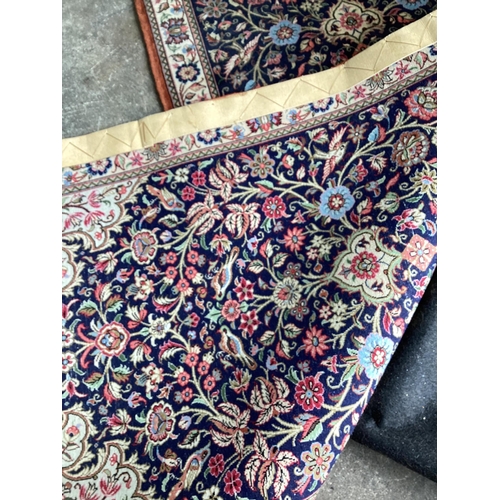 80 - ** ** A modern Persian dark blue ground runner, 185 x 70cms Please note this lot attracts an additio... 