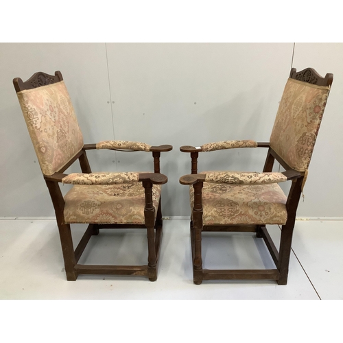 83 - A pair of oak elbow chairs, width 64cm, depth 60cm, height 114cm