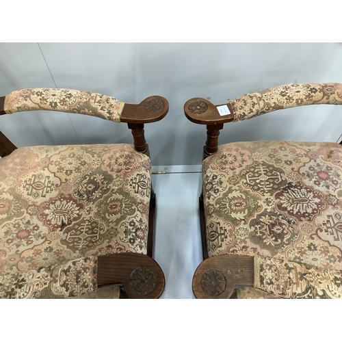 83 - A pair of oak elbow chairs, width 64cm, depth 60cm, height 114cm