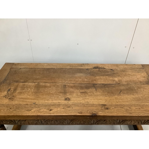 85 - A 17th century style rectangular oak refectory dining table, incorporates old timber, width 168cm, d... 