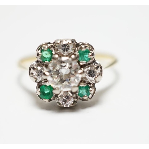 931 - A yellow metal, diamond and emerald set flower head cluster ring, size P, gross weight 4 grams, the ... 