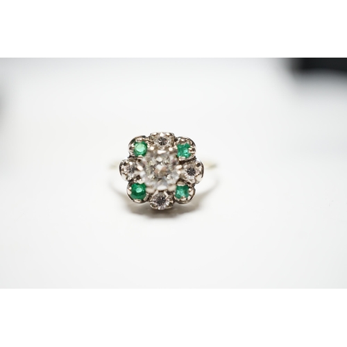 931 - A yellow metal, diamond and emerald set flower head cluster ring, size P, gross weight 4 grams, the ... 