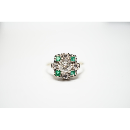 931 - A yellow metal, diamond and emerald set flower head cluster ring, size P, gross weight 4 grams, the ... 