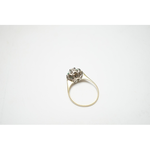 931 - A yellow metal, diamond and emerald set flower head cluster ring, size P, gross weight 4 grams, the ... 
