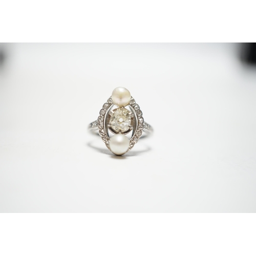 933 - A white metal single stone diamond and two stone cultured pearl set oval ring, with diamond chip set... 