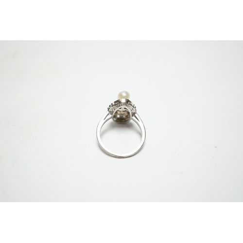 933 - A white metal single stone diamond and two stone cultured pearl set oval ring, with diamond chip set... 