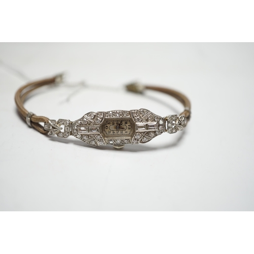 943 - A lady's 1940's/1950's white metal (engraved platinum) and diamond cluster set manual wind cocktail ... 