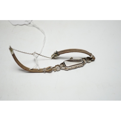 943 - A lady's 1940's/1950's white metal (engraved platinum) and diamond cluster set manual wind cocktail ... 