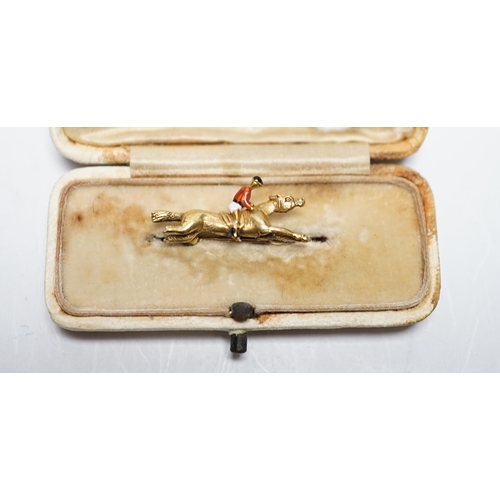 944 - An Edwardian yellow metal, and polychrome enamelled novelty brooch, modelled as a horse with jockey,... 