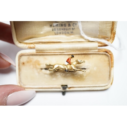 944 - An Edwardian yellow metal, and polychrome enamelled novelty brooch, modelled as a horse with jockey,... 