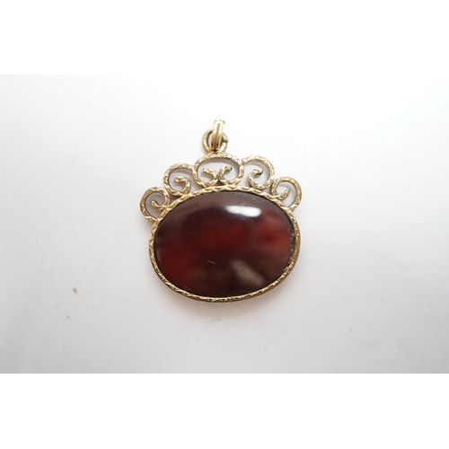 946 - A yellow metal mounted oval intaglio agate? pendant, carved with the bust of a lady to dexter, width... 