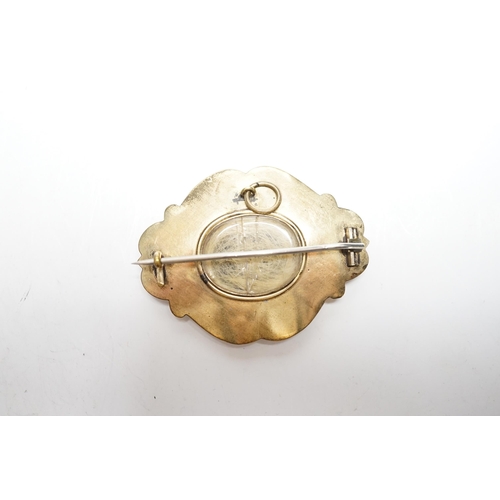 953 - A Victorian yellow metal, black enamel and seed pearl set mourning brooch, 47mm.