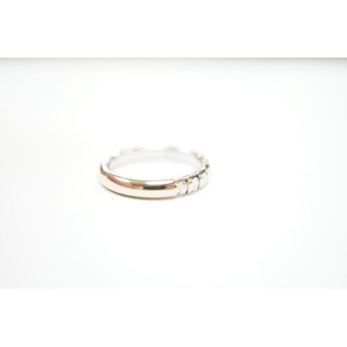 967 - A modern 18ct white gold and five stone diamond set half hoop ring, size J, gross weight 3.6 grams.... 