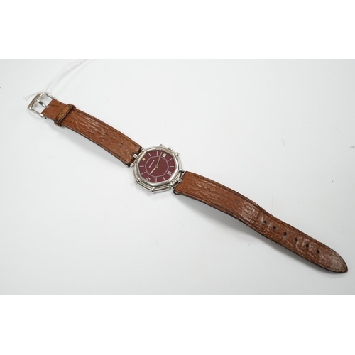 968 - A gentleman's Swiss stainless steel Gerald Genta quartz octagonal wrist watch, with burgundy dial an... 