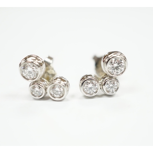 972 - A modern pair of Tiffany & Co platinum and three stone graduated diamond set ear studs, 10mm, gross ... 