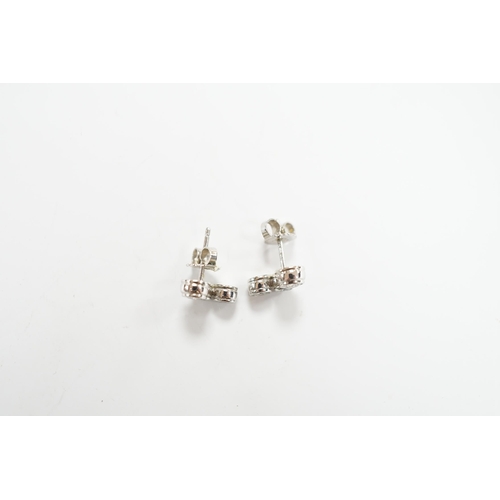 972 - A modern pair of Tiffany & Co platinum and three stone graduated diamond set ear studs, 10mm, gross ... 