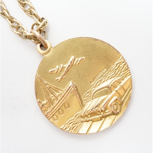 973 - A 1970's 9ct gold St. Christopher's pendant, 27mm, on a 9ct chain, 65cm, 22.6 grams.