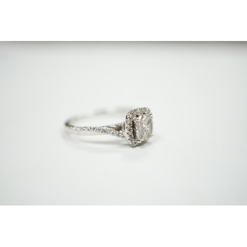 974 - A modern 14ct white gold and diamond set cluster ring, size M/N, gross weight 2.7 grams.