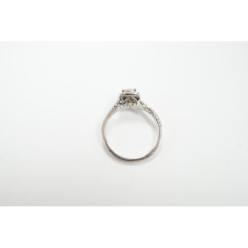 974 - A modern 14ct white gold and diamond set cluster ring, size M/N, gross weight 2.7 grams.