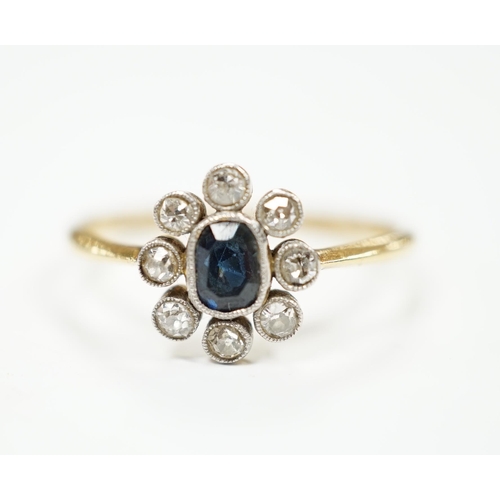 975 - An 18ct, sapphire and diamond cluster set oval ring, size M, gross weight 2 grams.