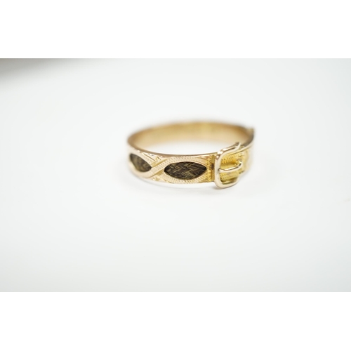 978 - A late Victorian 9ct gold and inset hair mourning buckle ring, size U, gross weight 2.2 grams.... 