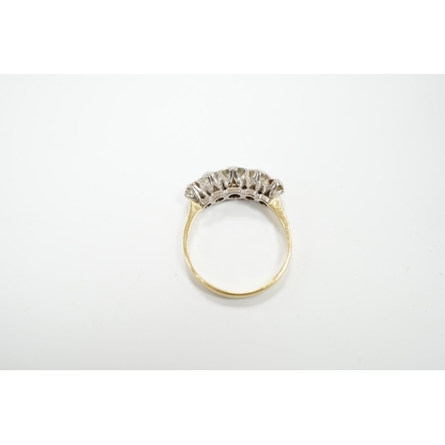 983 - An antique yellow metal and graduated old round cut diamond set half hoop ring, size Q, gross weight... 