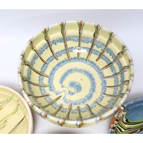 436 - Four drizzle glazed pottery bowls and a dark glazed jug, largest bowl 26cm diameter (5)