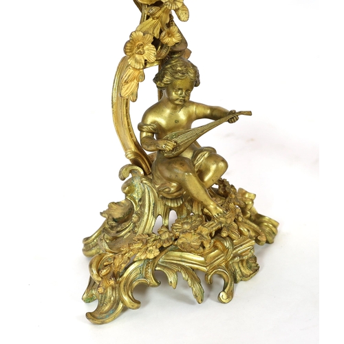 101 - A pair of late 19th century French Louis XVI style ormolu seven light candelabra, each with foliate ... 