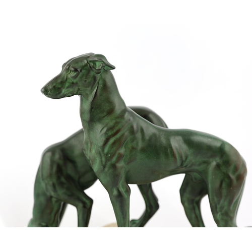 106 - Masson, a French Art Deco bronze and composition stone group of two hounds watering, signed in the b... 