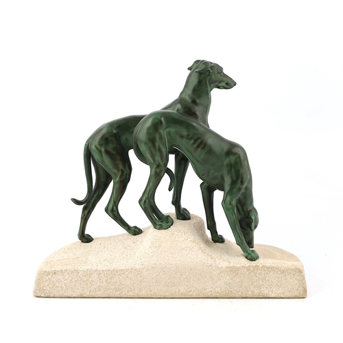 106 - Masson, a French Art Deco bronze and composition stone group of two hounds watering, signed in the b... 