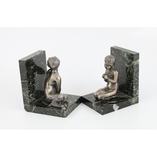 107 - Henri Fugère, a pair of silvered bronze and marble bookends modelled as a kneeling faun and girl hol... 