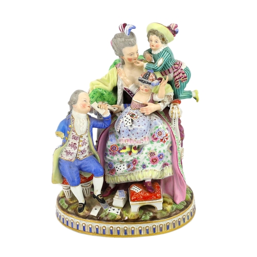 127 - A Meissen group The Good Mother, 19th century, with good detail to the clothing, playing cards and b... 