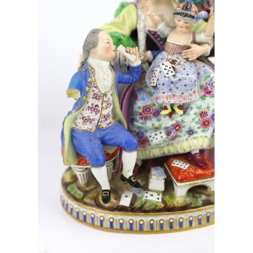 127 - A Meissen group The Good Mother, 19th century, with good detail to the clothing, playing cards and b... 