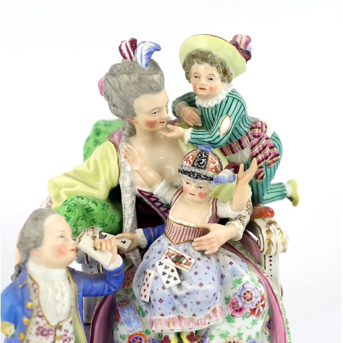 127 - A Meissen group The Good Mother, 19th century, with good detail to the clothing, playing cards and b... 