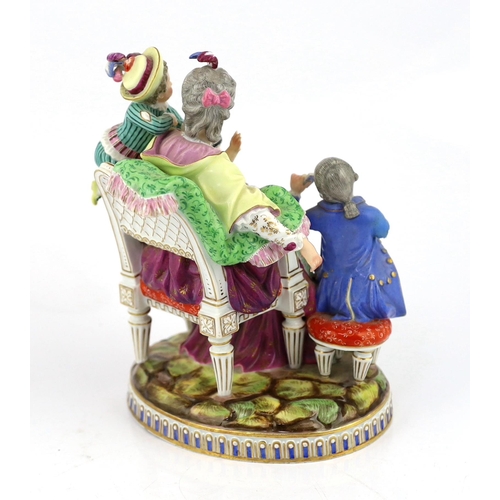 127 - A Meissen group The Good Mother, 19th century, with good detail to the clothing, playing cards and b... 