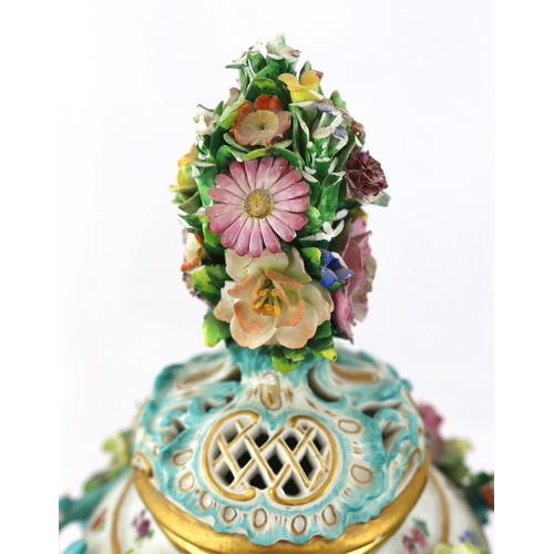 130 - A pair of Meissen topographical flower encrusted vases and covers, 19th century, each painted with t... 